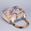 O1CN010pK4CK1cfDfAdvP2N_2209246163627-0-cib.jpg_ 2025 New Embroidered Sequin Handbag with Bamboo Handle, Women's Niche High-End Fashion Bag