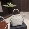 Structured Top-Handle Hobo Bag with Tassel Charm