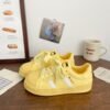 Small white shoes women 2025 spring new explosions niche shoes shell head board shoes students Joker casual sneaker