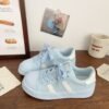 Small white shoes women 2025 spring new explosions niche shoes shell head board shoes students Joker casual sneaker